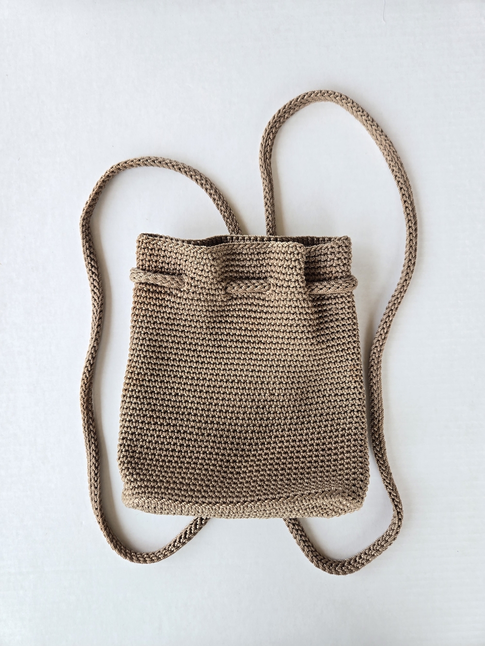 The Sak Crochet Knit Drawstring Backpack in Light Brown